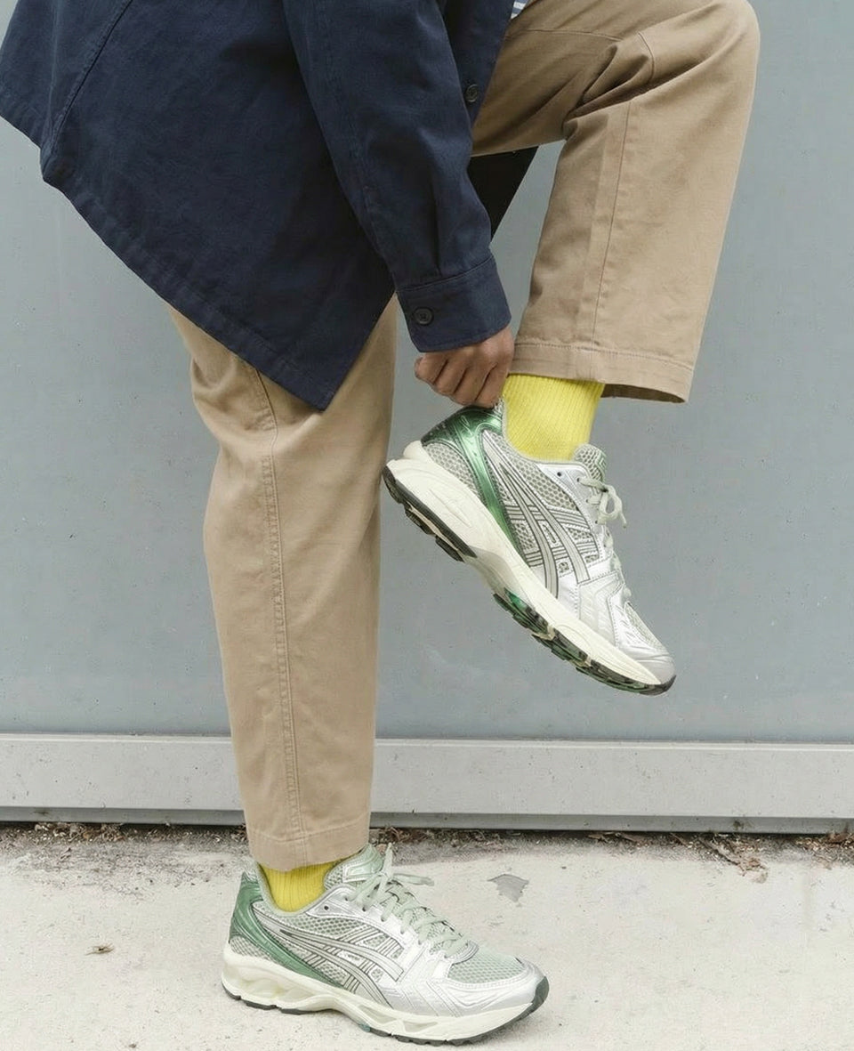 Yellow premium socks with khaki pants and sneakers – smart casual menswear styling with organic cotton ribbed socks