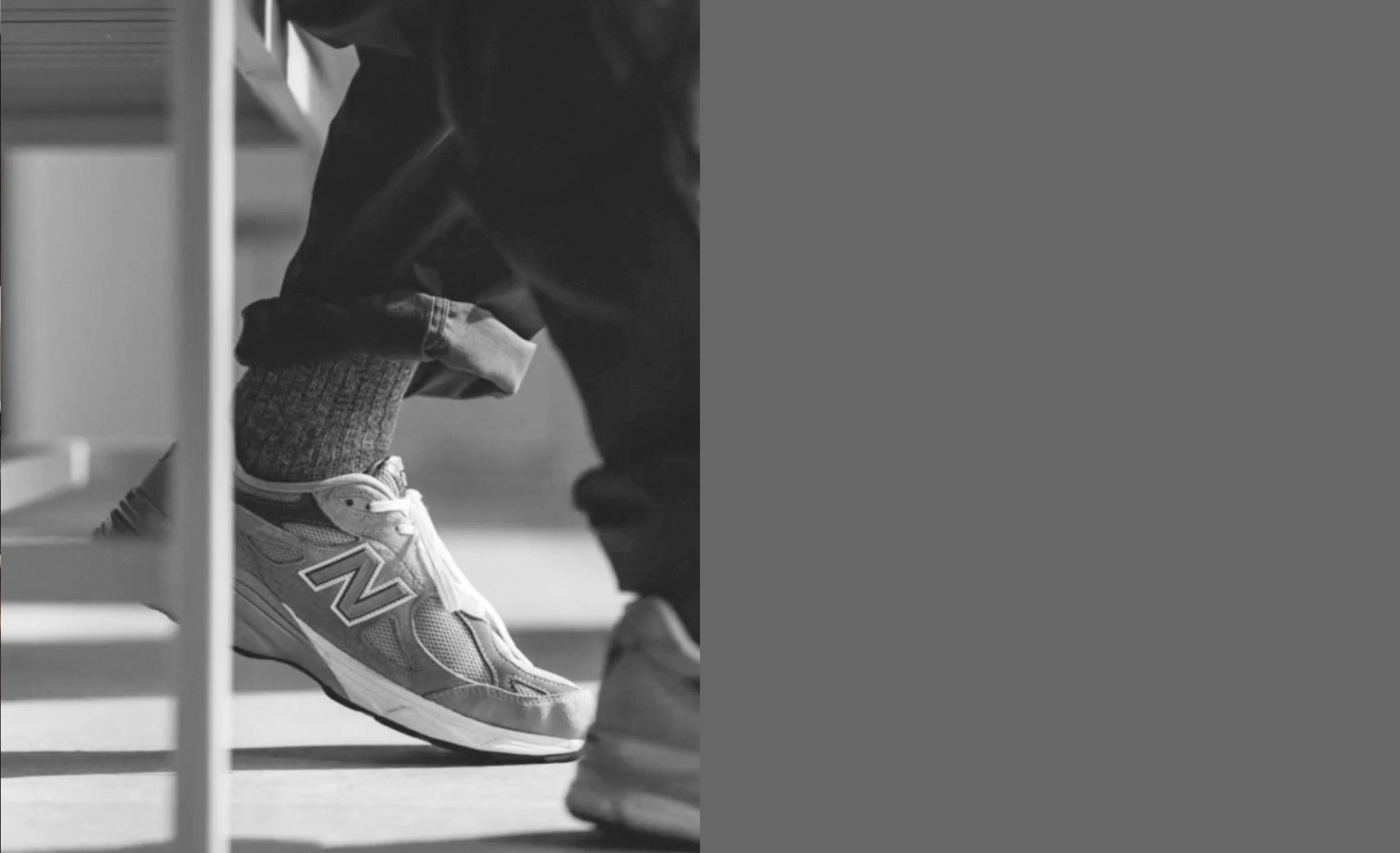 Person wearing a New Balance sneaker with a melange sock. New monochrome collection